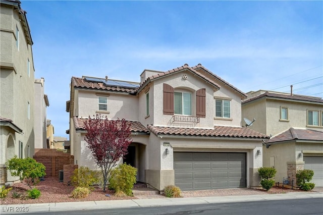 10722 Red Badge Ave, Las Vegas, NV 89166 - mediterranean / spanish-style home with stucco siding, a tiled roof, roof mounted solar panels, and a garage