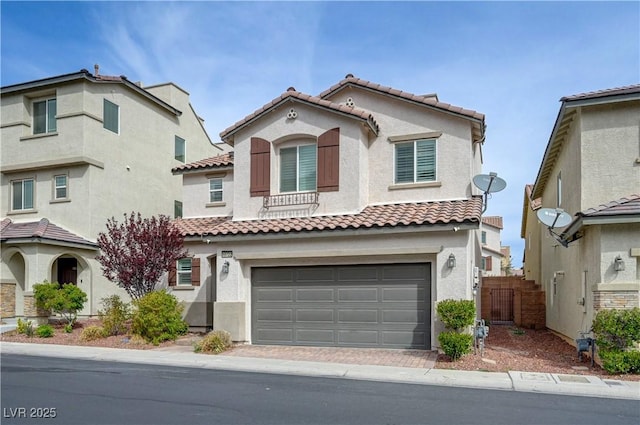 10722 Red Badge Ave, Las Vegas, NV 89166 - mediterranean / spanish-style home with a tiled roof, an attached garage, stucco siding, and driveway