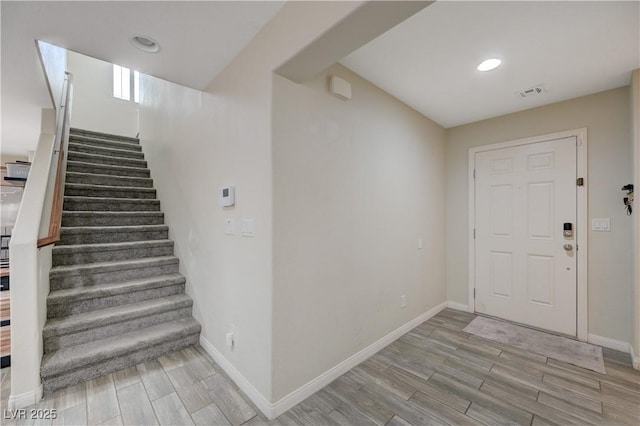 10722 Red Badge Ave, Las Vegas, NV 89166 - foyer featuring light wood-style flooring, stairs, and recessed lighting