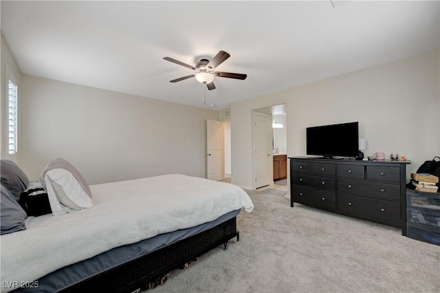 10722 Red Badge Ave, Las Vegas, NV 89166 - bedroom featuring light carpet, a ceiling fan, and connected bathroom