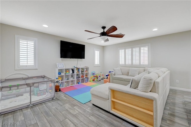 10722 Red Badge Ave, Las Vegas, NV 89166 - living area featuring a ceiling fan, recessed lighting, and wood finished floors