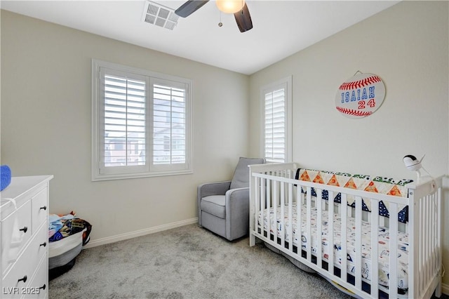 10722 Red Badge Ave, Las Vegas, NV 89166 - carpeted bedroom with a nursery area and a ceiling fan