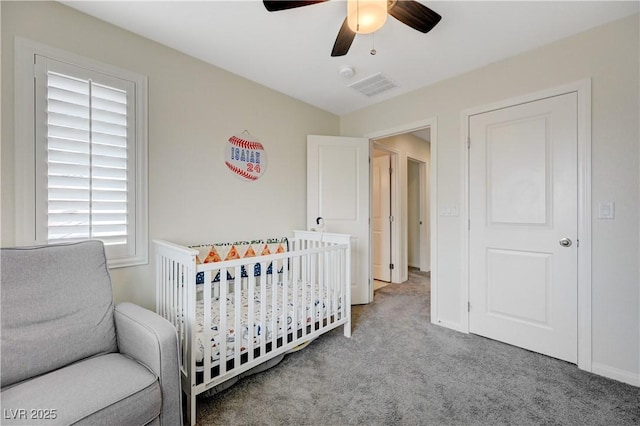 10722 Red Badge Ave, Las Vegas, NV 89166 - carpeted bedroom featuring a nursery area and ceiling fan