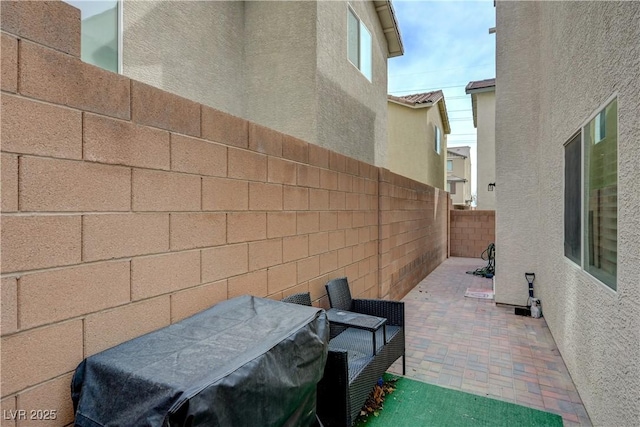 10722 Red Badge Ave, Las Vegas, NV 89166 - fenced backyard with a patio area