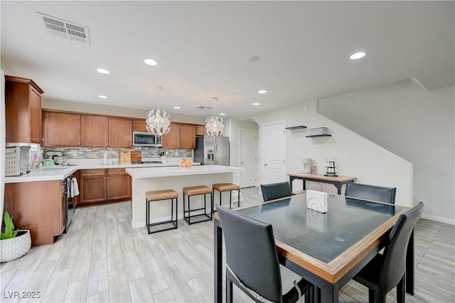 10722 Red Badge Ave, Las Vegas, NV 89166 - dining room featuring recessed lighting and light wood-style flooring