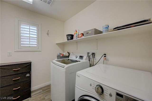 10722 Red Badge Ave, Las Vegas, NV 89166 - washroom featuring washing machine and clothes dryer and light wood finished floors