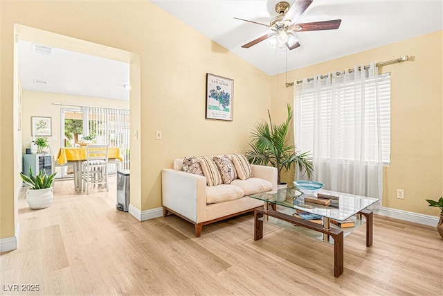 8611 Gabilan Ct, Las Vegas, NV 89123 - living room with light wood finished floors, a ceiling fan, and vaulted ceiling