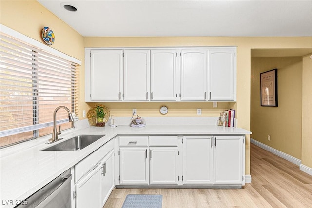 8611 Gabilan Ct, Las Vegas, NV 89123 - kitchen featuring dishwasher, light countertops, white cabinets, and light wood-style flooring