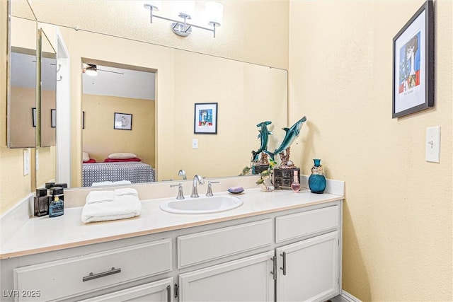 8611 Gabilan Ct, Las Vegas, NV 89123 - ensuite bathroom with vanity and a ceiling fan