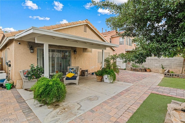 8611 Gabilan Ct, Las Vegas, NV 89123 - back of property featuring stucco siding, a patio area, and a tiled roof