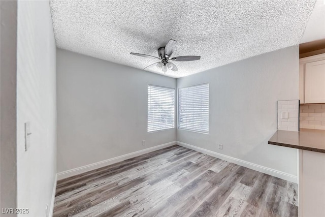 2200 S Fort Apache Rd Unit 2209, Las Vegas, NV 89117 - empty room with wood finished floors, ceiling fan, and a textured ceiling