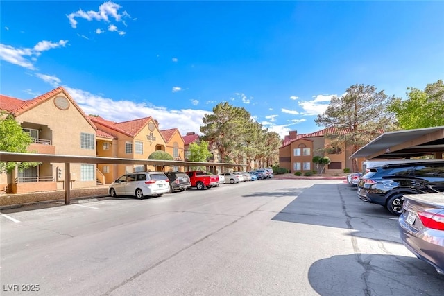 2200 S Fort Apache Rd Unit 2209, Las Vegas, NV 89117 - partially covered parking lot with a residential view