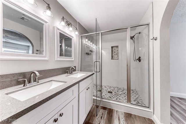 2200 S Fort Apache Rd Unit 2209, Las Vegas, NV 89117 - full bath with wood finished floors, double vanity, and a shower stall