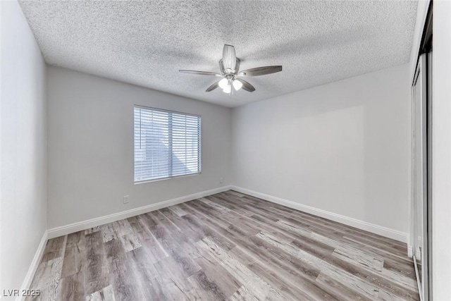 2200 S Fort Apache Rd Unit 2209, Las Vegas, NV 89117 - empty room featuring ceiling fan, wood finished floors, and a textured ceiling
