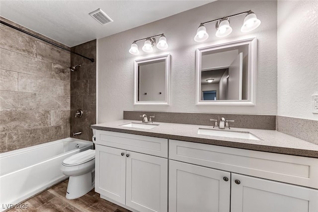 2200 S Fort Apache Rd Unit 2209, Las Vegas, NV 89117 - full bath featuring double vanity, shower / washtub combination, wood finished floors, and a textured wall