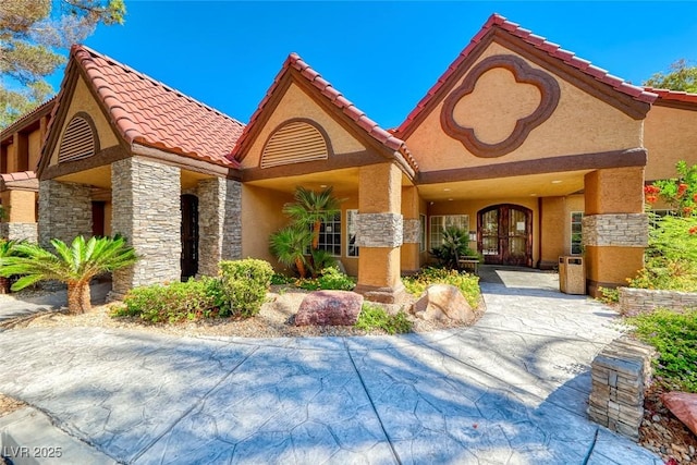 2200 S Fort Apache Rd Unit 2209, Las Vegas, NV 89117 - view of front of house featuring stone siding, stucco siding, and a tiled roof