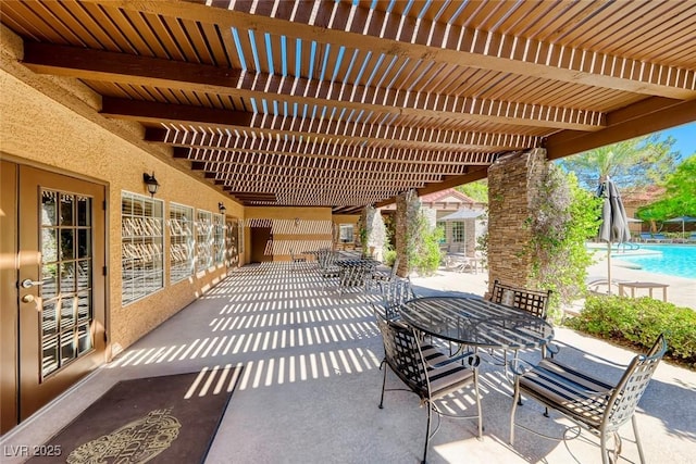 2200 S Fort Apache Rd Unit 2209, Las Vegas, NV 89117 - view of patio featuring a pergola, a community pool, and outdoor dining area