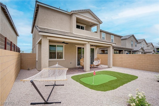 6591 Dove Point Pl, Las Vegas, NV 89130 - back of property featuring a patio, stucco siding, a fenced backyard, and a balcony