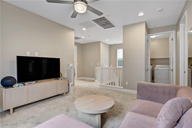 6591 Dove Point Pl, Las Vegas, NV 89130 - living area featuring washer / dryer, light colored carpet, a ceiling fan, and recessed lighting