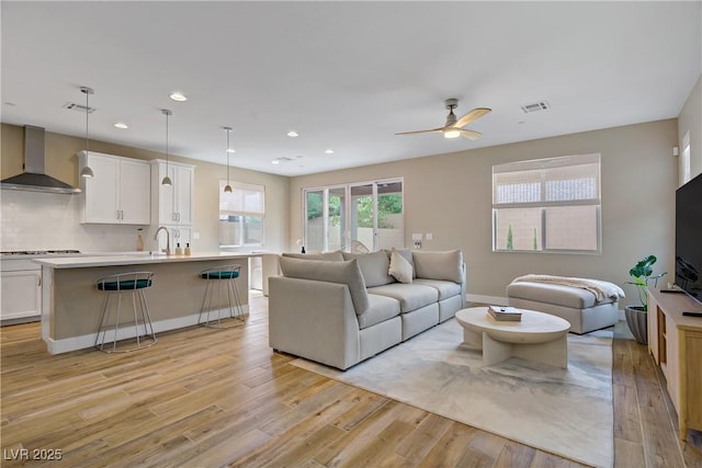 6591 Dove Point Pl, Las Vegas, NV 89130 - living area featuring light wood-style flooring, a ceiling fan, and recessed lighting