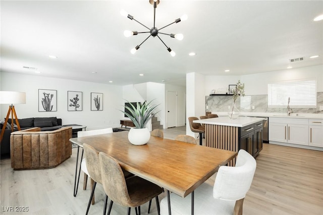 5505 Eagle Cove Ave, Las Vegas, NV 89130 - dining space with light wood-style floors, a chandelier, and recessed lighting
