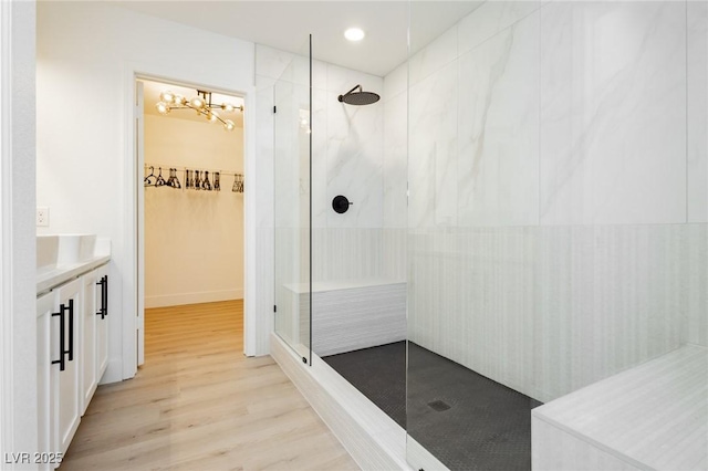 5505 Eagle Cove Ave, Las Vegas, NV 89130 - full bathroom with walk in shower, a chandelier, vanity, wood finished floors, and recessed lighting
