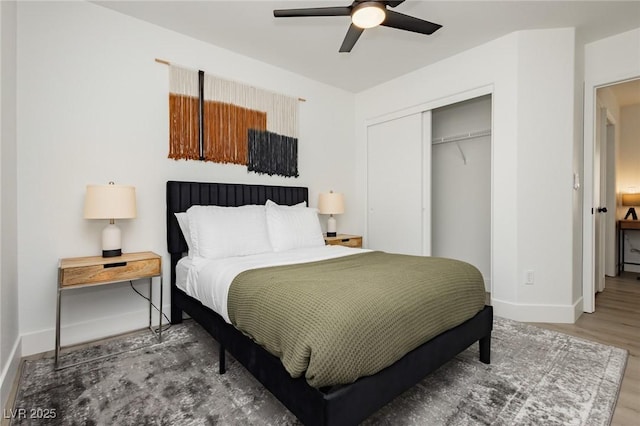 5505 Eagle Cove Ave, Las Vegas, NV 89130 - bedroom with a closet, wood finished floors, and a ceiling fan