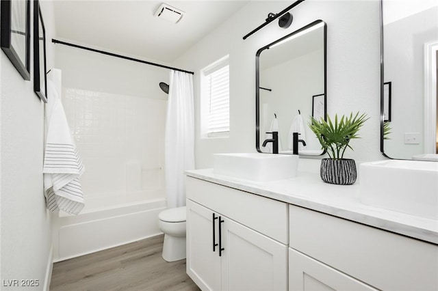 5505 Eagle Cove Ave, Las Vegas, NV 89130 - full bathroom featuring double vanity, wood finished floors, and shower / tub combo