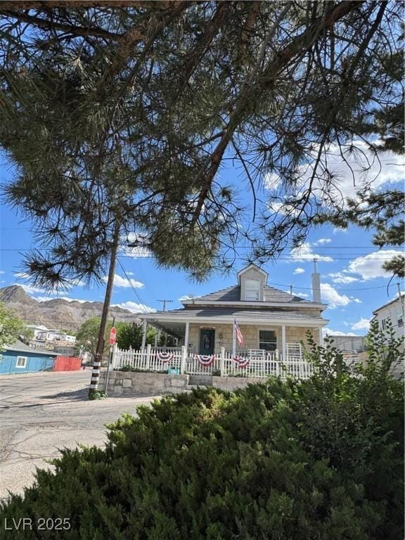 191 S Booker, Tonopah, NV 89049 - view of front facade featuring covered porch and a mountain view