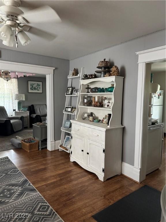 191 S Booker, Tonopah, NV 89049 - living room featuring a ceiling fan and dark wood-style flooring