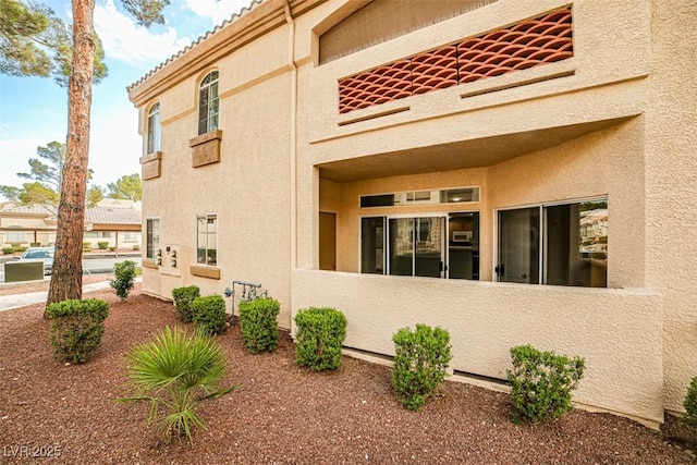 7400 W Flamingo Rd Unit 1051, Las Vegas, NV 89147 - view of home's exterior with stucco siding and a tiled roof
