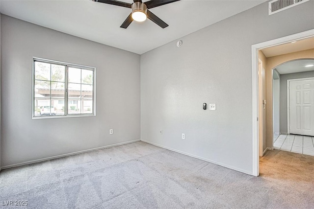 7400 W Flamingo Rd Unit 1051, Las Vegas, NV 89147 - spare room featuring carpet, ceiling fan, and arched walkways