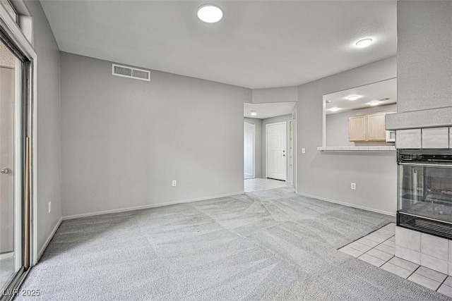 7400 W Flamingo Rd Unit 1051, Las Vegas, NV 89147 - unfurnished living room featuring carpet floors and tile patterned flooring