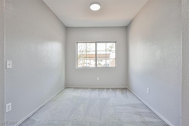 7400 W Flamingo Rd Unit 1051, Las Vegas, NV 89147 - spare room featuring a textured wall and carpet flooring