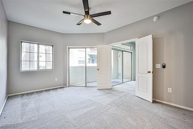 7400 W Flamingo Rd Unit 1051, Las Vegas, NV 89147 - unfurnished bedroom featuring light carpet and a ceiling fan