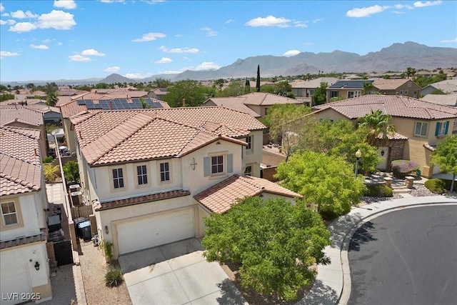 9413 Arcadia Woods Ct, Las Vegas, NV 89149 - view of front facade featuring a residential view, a tiled roof, stucco siding, and a garage