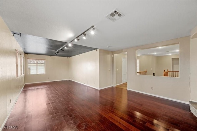 9413 Arcadia Woods Ct, Las Vegas, NV 89149 - unfurnished room featuring hardwood / wood-style flooring and track lighting
