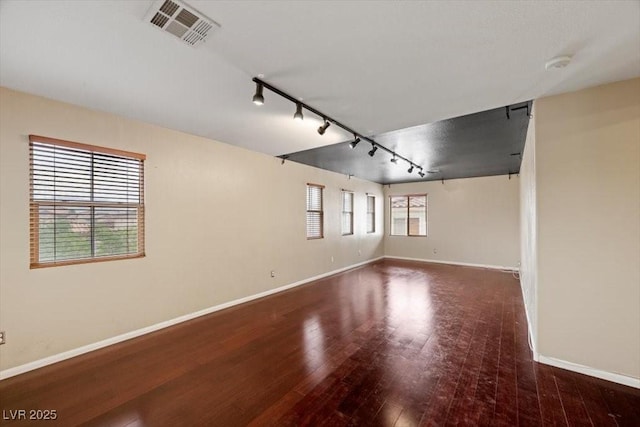 9413 Arcadia Woods Ct, Las Vegas, NV 89149 - empty room with rail lighting, hardwood / wood-style floors, and a smoke detector