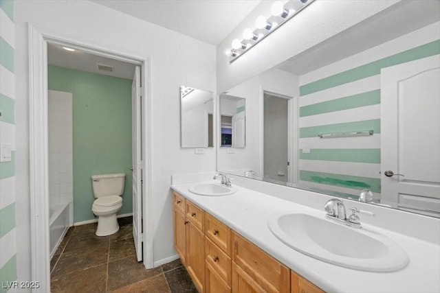 9413 Arcadia Woods Ct, Las Vegas, NV 89149 - bathroom with double vanity and toilet