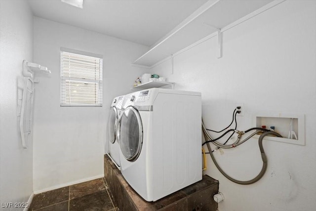 9413 Arcadia Woods Ct, Las Vegas, NV 89149 - laundry area featuring independent washer and dryer and dark stone finish flooring