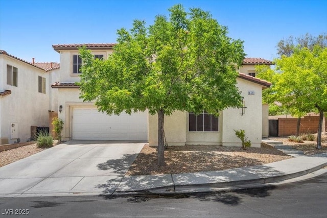 9413 Arcadia Woods Ct, Las Vegas, NV 89149 - mediterranean / spanish house with a tiled roof, stucco siding, concrete driveway, and a garage