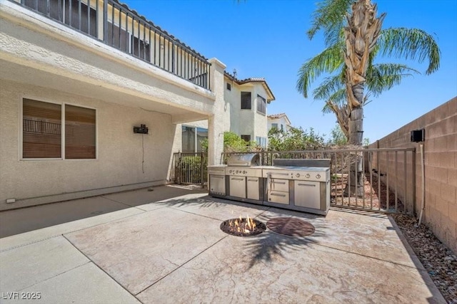 9413 Arcadia Woods Ct, Las Vegas, NV 89149 - view of patio featuring area for grilling and an outdoor fire pit
