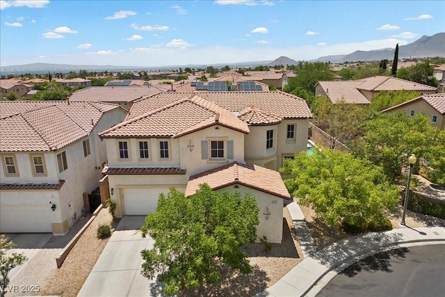 9413 Arcadia Woods Ct, Las Vegas, NV 89149 - mediterranean / spanish home featuring stucco siding, a residential view, a tiled roof, an attached garage, and driveway