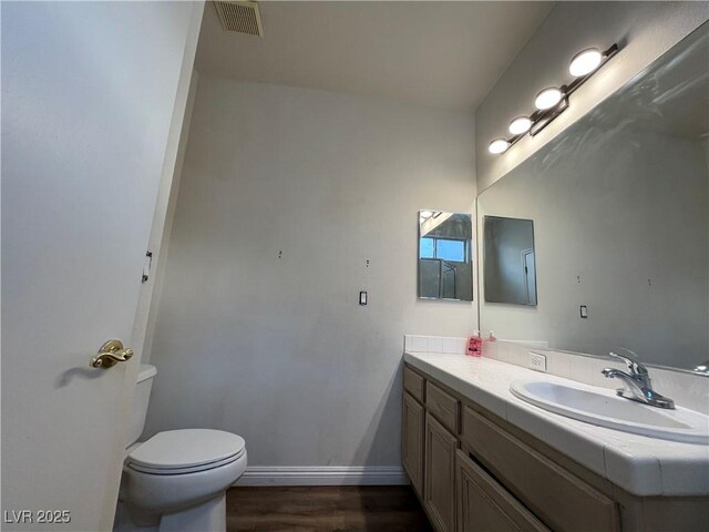 bathroom featuring vanity and wood finished floors