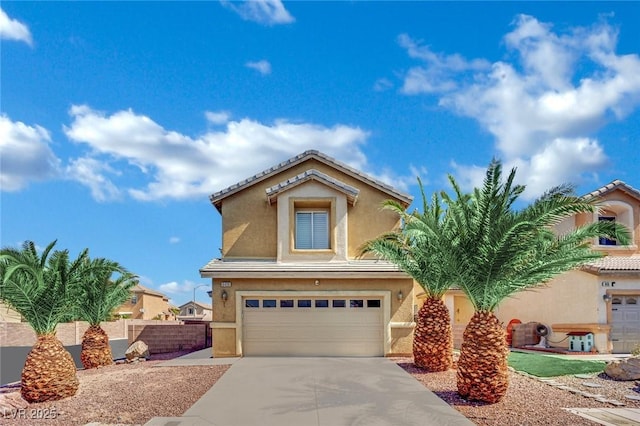 6430 Jackrabbit Run Ave, Las Vegas, NV 89122 - view of front facade with a garage, stucco siding, and driveway