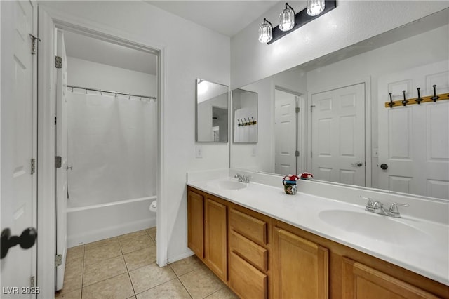 6430 Jackrabbit Run Ave, Las Vegas, NV 89122 - full bath featuring double vanity, tile patterned flooring, and shower / tub combo