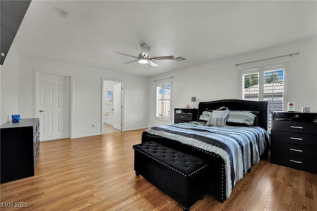 6430 Jackrabbit Run Ave, Las Vegas, NV 89122 - bedroom with light wood finished floors and ceiling fan