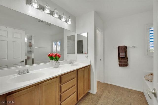 6430 Jackrabbit Run Ave, Las Vegas, NV 89122 - bathroom featuring double vanity, tile patterned floors, and a shower with shower door