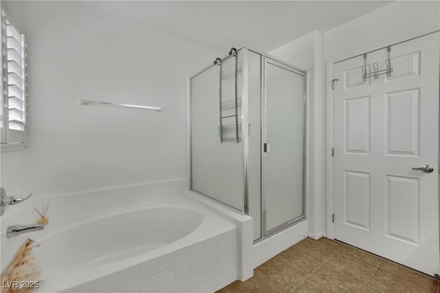 6430 Jackrabbit Run Ave, Las Vegas, NV 89122 - bathroom with a bath, a stall shower, and tile patterned flooring