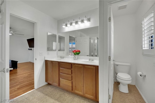 6430 Jackrabbit Run Ave, Las Vegas, NV 89122 - full bathroom with tile patterned floors, double vanity, plenty of natural light, and a ceiling fan